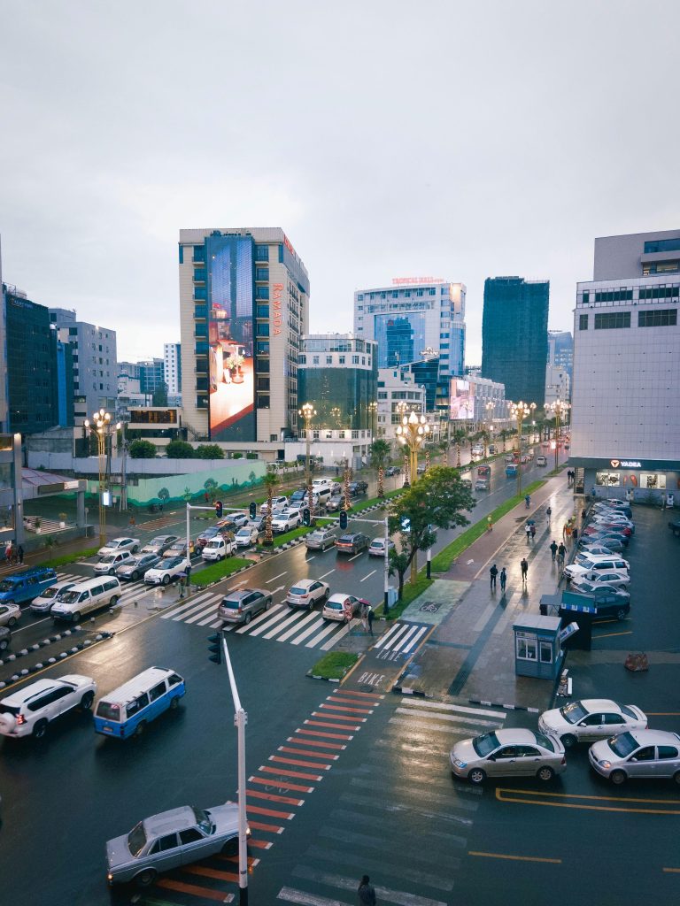 View of Addis Ababa's bustling streets and modern architecture on a rainy day.